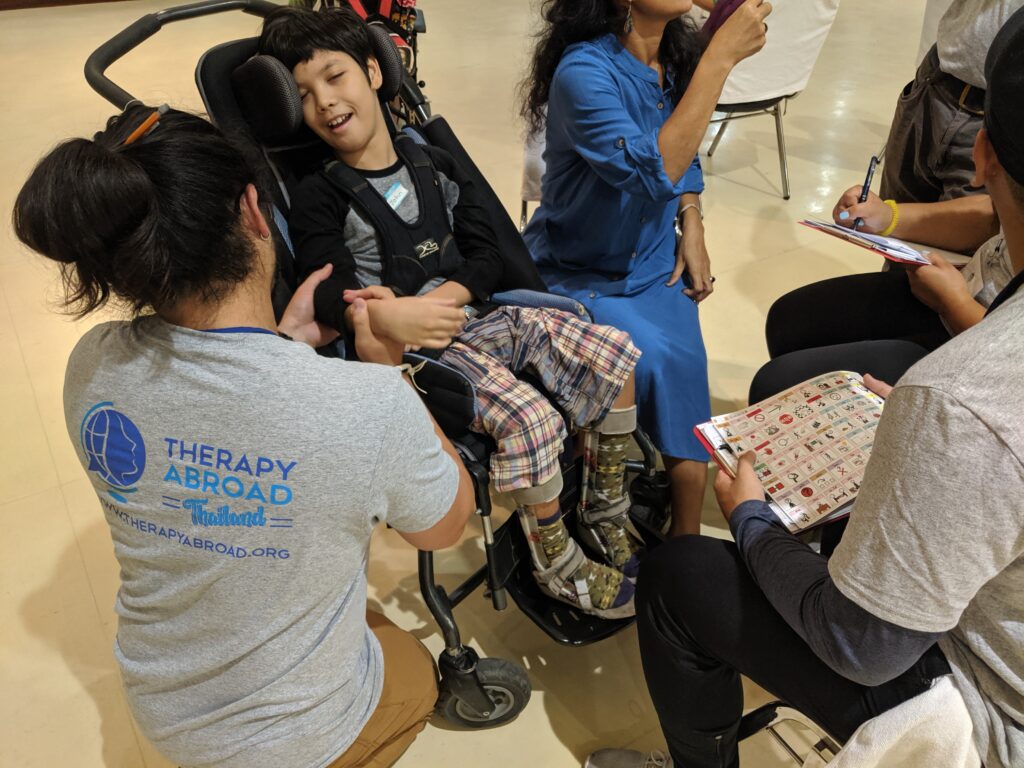physical therapy students talking to a patient