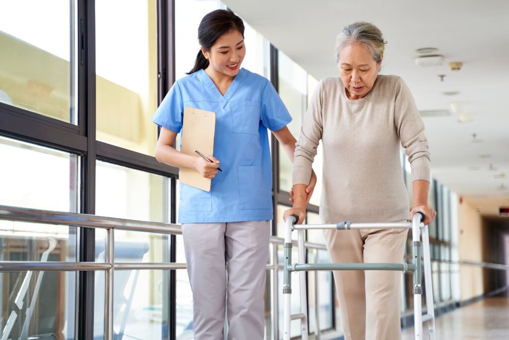 therapy assistant helping patient