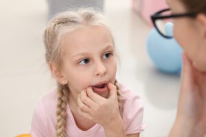 a child learning with a speech pathologist