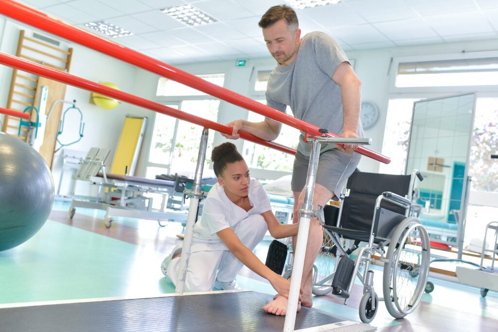 a physical therapist assisting a patient on a wheelchair