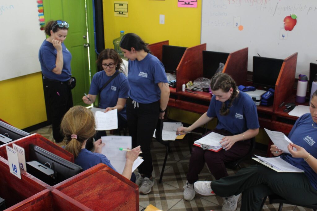 A group reviews papers together.