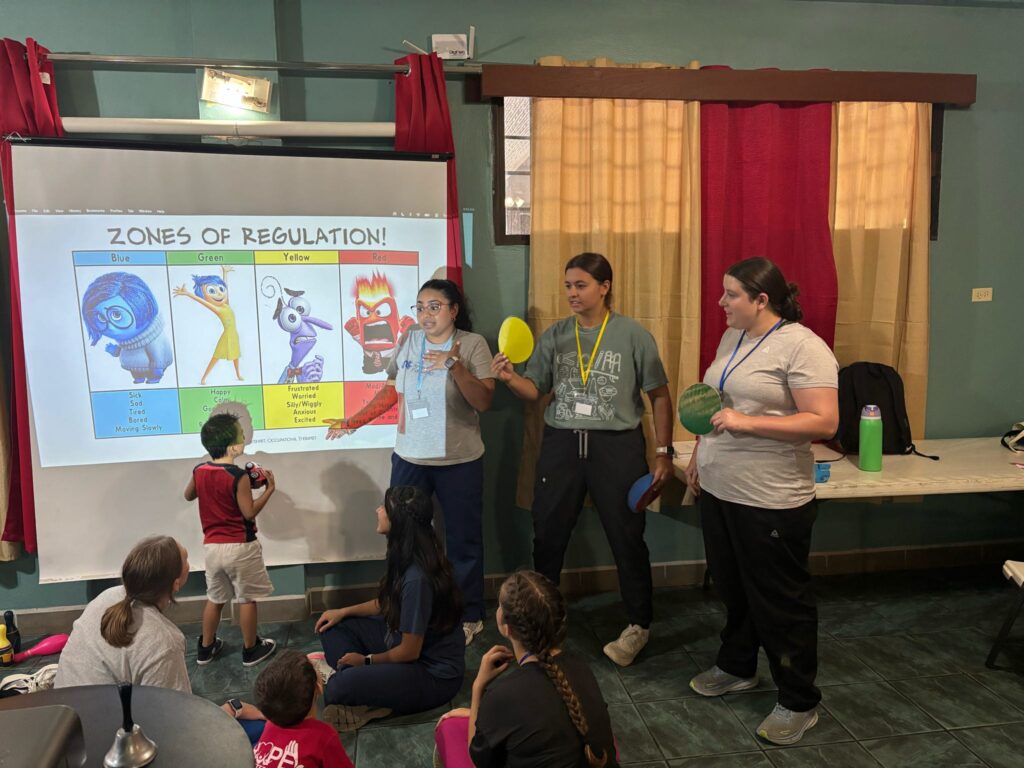 Participants attend a group learning activity with a projected slide.