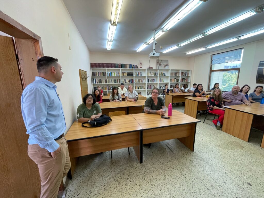 A group takes part in a discussion with an instructor.