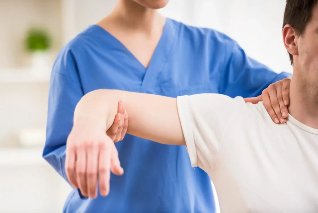 a physical therapist with a patient