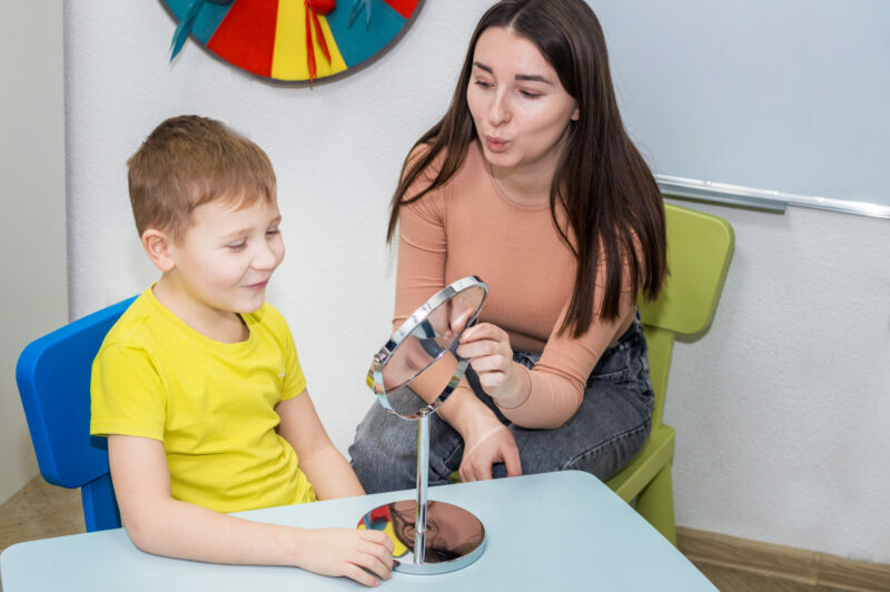 a speech language pathologist with a patient